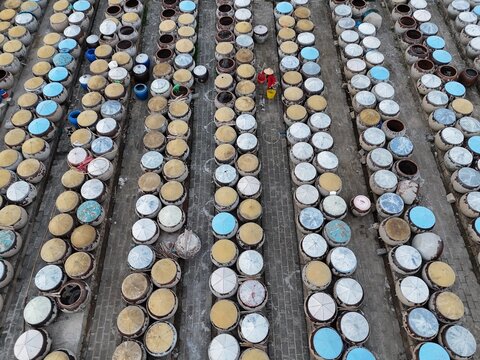 Aerial view of countless jars lined up in neat rows, their lids reflecting the sunlight in a dazzling display of colors, Ho Chi Minh City, Ho Chi Minh City, Vietnam.