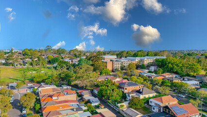 Aerial Panorama Drone View of a inner western Sydney Suburb of Ashbury Urban Sprawl and the terracotta roof tops streets and trees of Suburban Sydney  NSW Australia