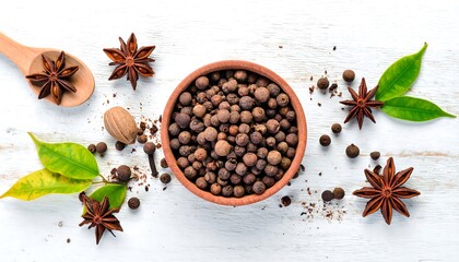 Aromatic Spices - Star Anise and Peppercorns on White Surface.