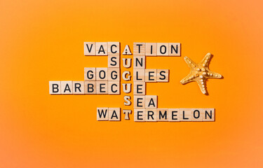 Wooden block crossword puzzle on orange background