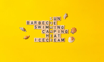 Crossword puzzle with wooden blocks on yellow background