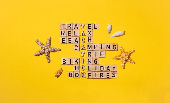 Crossword puzzle with wooden blocks and a summer theme