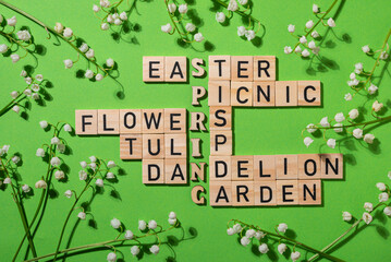 Wooden blocks crossword on green background