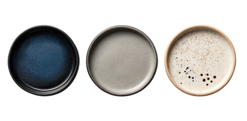 Three shallow, circular ceramic dishes in varying colors and textures