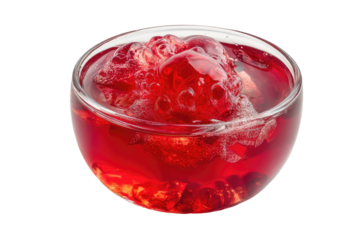 Red fruit jelly with berries in a clear glass bowl