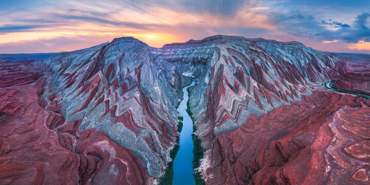 Vibrant rock formations over Rio San Juan at sunset