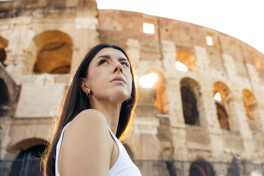 Woman enjoying a sunny day at the Colosseum in Rome