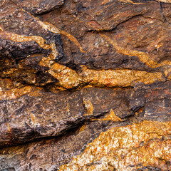 Warm Brown Granite Texture with Orange Mineral Streaks Close-Up Texture