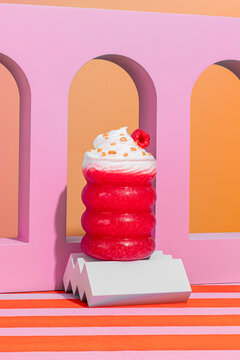 Raspberry smoothie with whipped cream in vibrant setting