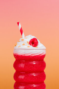 Fresh raspberry smoothie with whipped cream topping