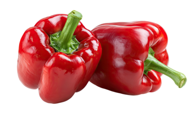Two vibrant red bell peppers with green stems on black