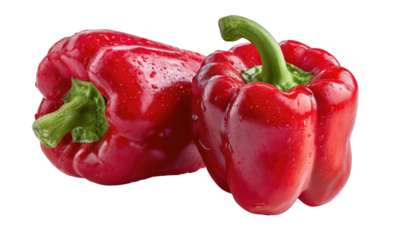 Two bright red bell peppers with green stems, glistening with water droplets