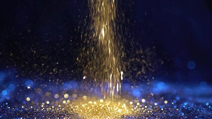Golden Glitter Falling on Blue and Gold Sparkling Bokeh Background 4K