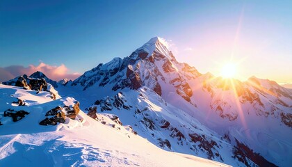 A breathtaking view of a snow-covered mountain range at sunrise, with the sun's rays illuminating the peaks and casting a warm glow.