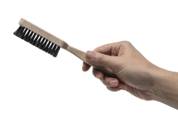 hand holding a brush ready to perform tasks . Isolated on transparent background, png