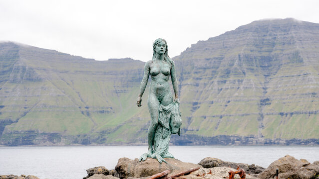 Woman statue by the sea in the Faroe Islands