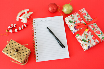 new year Wish List and Gifts on a Red Background