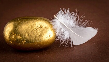 Golden Egg and Feather - A Study in Weight and Value.