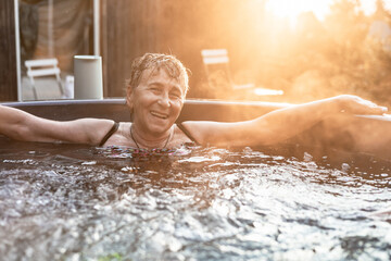 Woman enjoying relaxing time in a serene hot tub