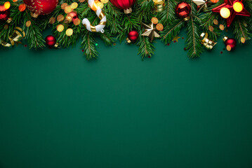 Christmas background with xmas tree, Christmas decoration and sparkle bokeh lights on green...