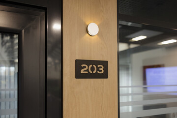 Room 203 stands ready for meetings in modern office space filled with natural light