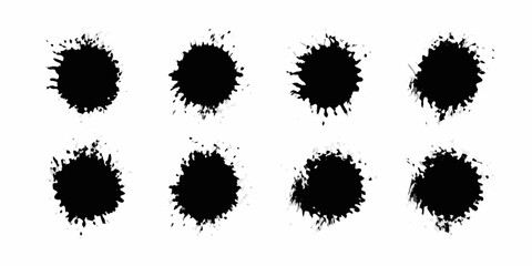 Collection of eight black ink splatters with textured edges on a white background