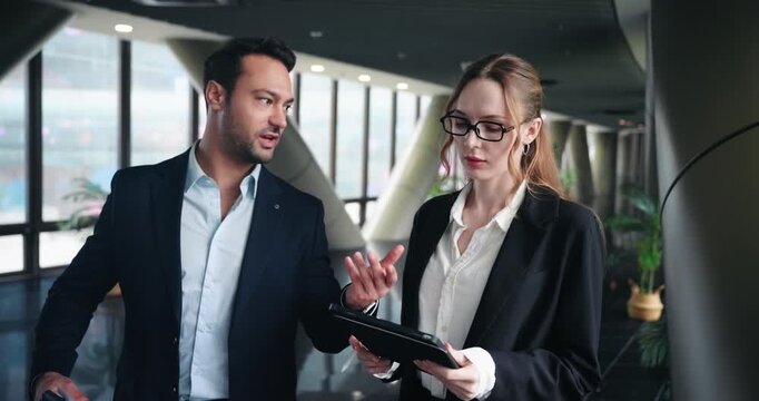 Businessman Explaining Report To The Woman Listening Attentively. - medium shot