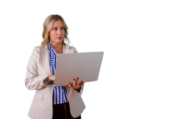 Professional businesswoman in corporate blazer standing and using laptop, looking seriously, transparent background