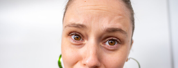 Young crying woman with hurt expression on face, showing sadness and resentment, emotional pain, Misunderstanding and disappointment, and vulnerable human feelings, Female emotion and expression