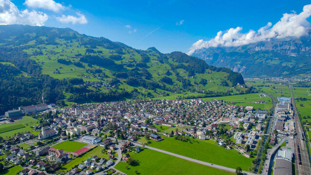 Fototapeta Aerial view around the capital city Flums in Switzerland on a sunny day in summer.