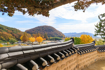 Autumn scenery showing the traditional tiled roofs of Yangdong Village, an old village in Gyeongju, Korea.