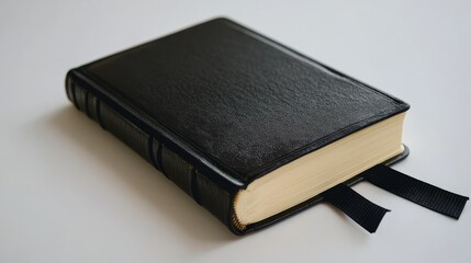 Leather bound book with black strap and hardcover, open and isolated on white background for journal or diary concept.