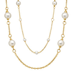An elegant gold chain necklace adorned with luminous pearls