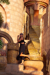 portrait of beautiful woman in sunglasses looking at camera