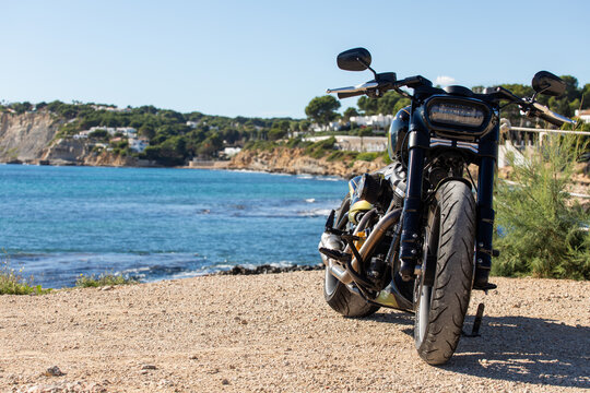 Custom motorcycle by scenic coastal view