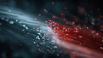 A dynamic visual of fiber optic strands emitting bright lights in red and white, creating a captivating sense of motion and energy.
