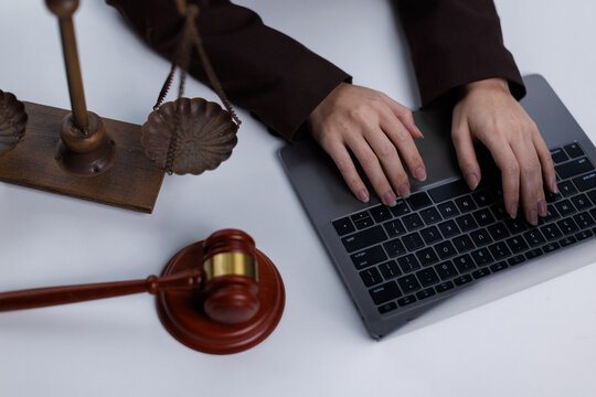 lawyer female working on laptop in dark office. Legal consultation and modern law firm concept.

