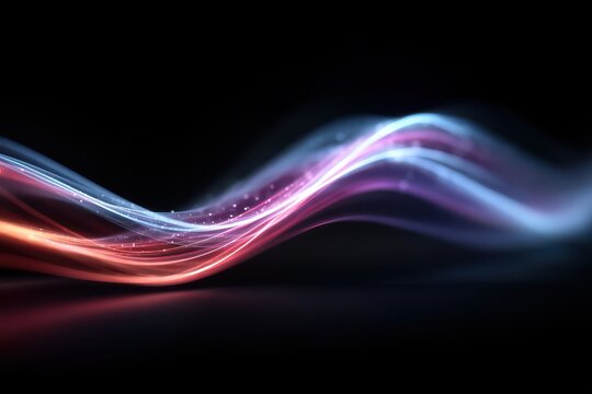Abstract neon light waves dance in vibrant colors across a dark background