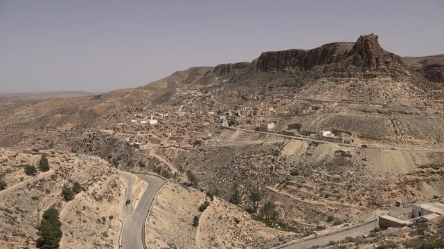Panoramic overview of picturesque historic village of Toujane and rugged mountain landscape with rock formations in Tunisia
