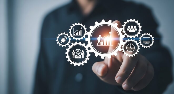 Businessman touching a digital interface showing gears and icons representing business processes, teamwork, and growth