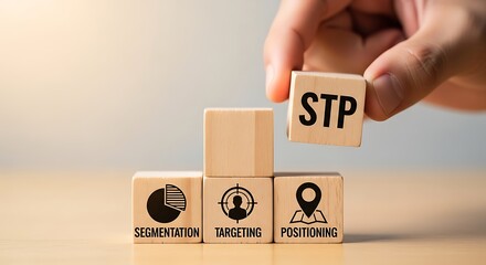 Hand placing wooden cube with stp acronym on blocks representing segmentation, targeting, and positioning strategy