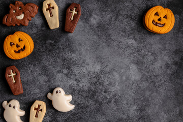 Halloween cookies on dark textured background view
