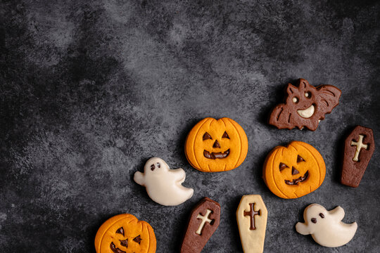 Halloween cookies on dark textured background