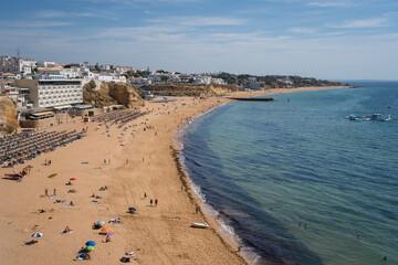 Golden sands of Albufeira under a clear Portuguese sky