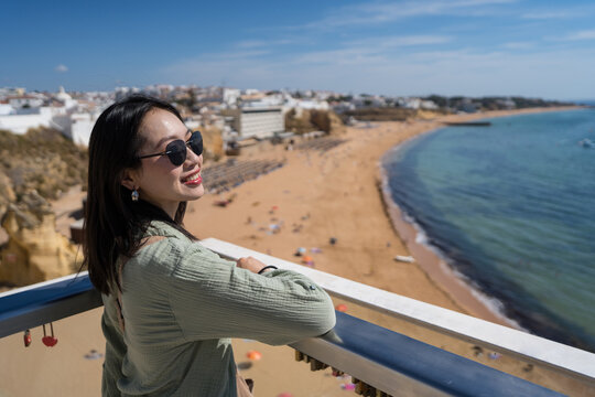 Woman enjoying the scenic view of Albufeira, Algarve