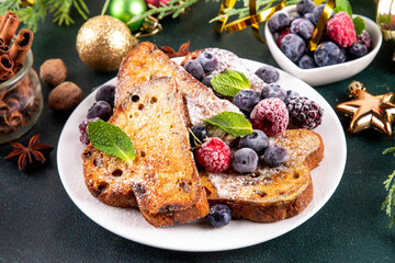 Leftover Christmas Spiced Stollen French Toasts, sweet fried stollen toasts with sugar powder and berries, Christmas morning dessert snack