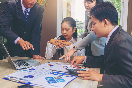 Business peoples meeting to discuss the situation on business plan, marketing for investment. Selected focus