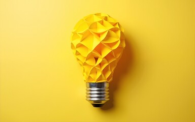 Light bulb made of yellow scrap paper ball, creative thinking concept. High quality