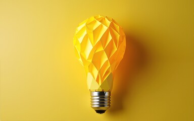 Light bulb made of yellow scrap paper ball, creative thinking concept. High quality