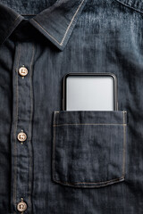 Top view of a smartphone with a white blank screen in the pocket of a denim shirt
